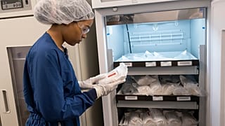 Examining materials inside the refrigeration room of our radioligand therapy (RLT) manufacturing facility in Indianapolis, Indiana, United States.