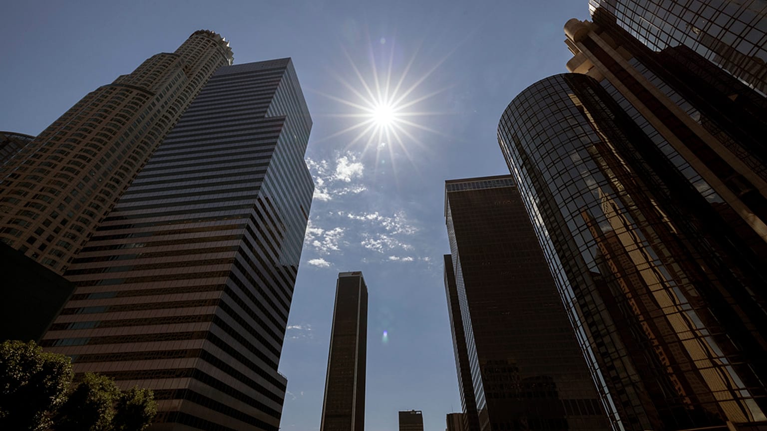 The sun shines over the financial district towers of downtown Los Angeles during a heatwave Friday, Sept. 6, 2024, in Los Angeles