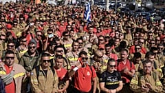 Hundreds of seasonal firefighters attend a protest outside Greece's Civil Protection Ministry in Athens