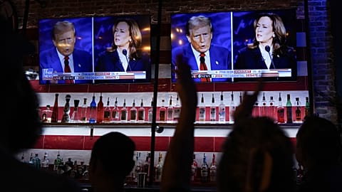 Viewers watch a debate between Kamala Harris and Donald Trump at a bar in San Antonio, 10 September, 2024
