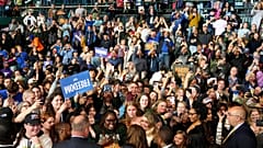 Democratic presidential nominee Vice President Kamala Harris, bottom center, greets supporters after speaking at a campaign rally on the campus of Michigan.