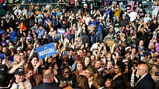 Democratic presidential nominee Vice President Kamala Harris, bottom center, greets supporters after speaking at a campaign rally on the campus of Michigan.