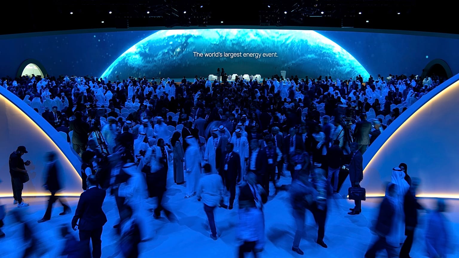 Visitors and delegates leave the hall after the opening session of annual Abu Dhabi International Petroleum Exhibition and Conference (ADIPEC) 