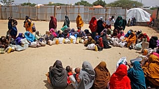 Somali families, who fled amid a drought, arrive at a makeshift camp on the outskirts of the capital Mogadishu