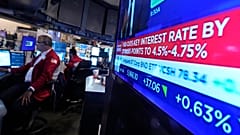 A screen at a trading post on the floor of the New York Stock Exchange displays the Federal Reserve interest rate decision