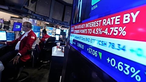 A screen at a trading post on the floor of the New York Stock Exchange displays the Federal Reserve interest rate decision