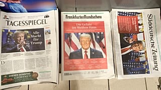 German newspapers front-pages with President-elect Donald Trump are seen at a station kiosk in Cologne, Germany
