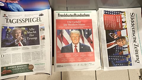 German newspapers front-pages with President-elect Donald Trump are seen at a station kiosk in Cologne, Germany