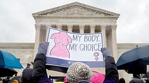 File photo: A pro-abortion rights supporter holds up a sign that reads "My Body. My Choice" during a rally outside the Supreme Court in Washington, Tuesday, March 20, 2018.
