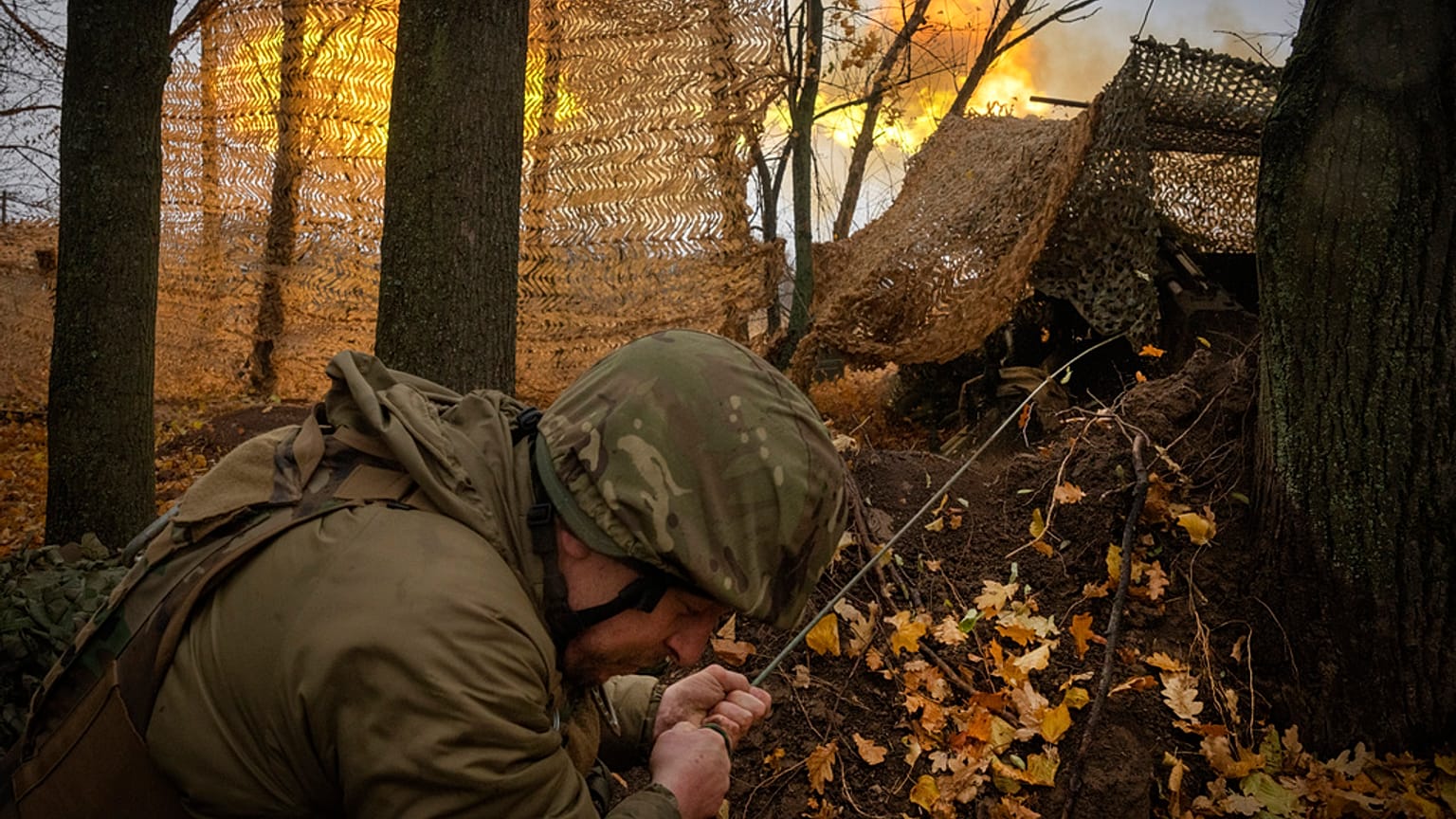 FILE - A serviceman of the 13th Brigade of the National Guard of Ukraine fires Giatsint-B gun towards Russian positions near Kharkiv, Ukraine, Wednesday, Nov. 6, 2024. 