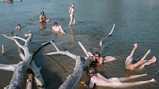 A crew from Liquid Becoming cool off during river voyage exploration