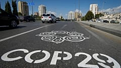 The logo for the COP29 United Nations Climate Change Conference is painted on a road in Baku, Azerbaijan, Monday, Sept. 16, 2024. 
