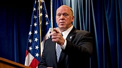 Tom Homan speaks to a reporter at a Department of Homeland Security news conference in Washington in 2017.