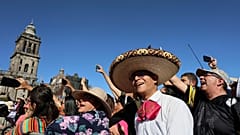 People sing with musicians who gathered to break the record of most mariachis performing in unison, at the Zocalo, Mexico City's main square, Sunday, Nov. 10, 2024. 