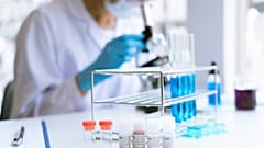 Medical research scientist working with a microscope to do research