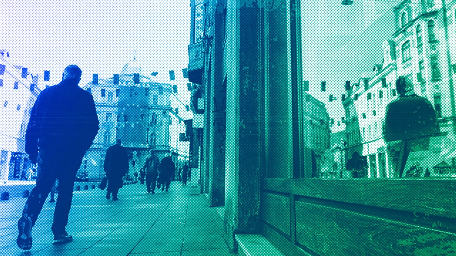 A man walks under European Union flags placed in one of the main streets in Sarajevo, 21 March 2024