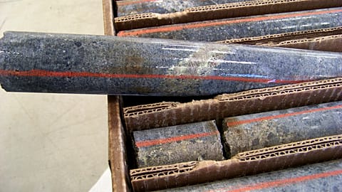 File picture of a core sample drilled from underground rock in the US shows a band of shiny minerals containing copper, nickel and precious metals 