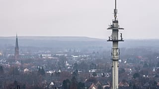 A radio mast for mobile communications is seen over the town of Bottrop, Germany.