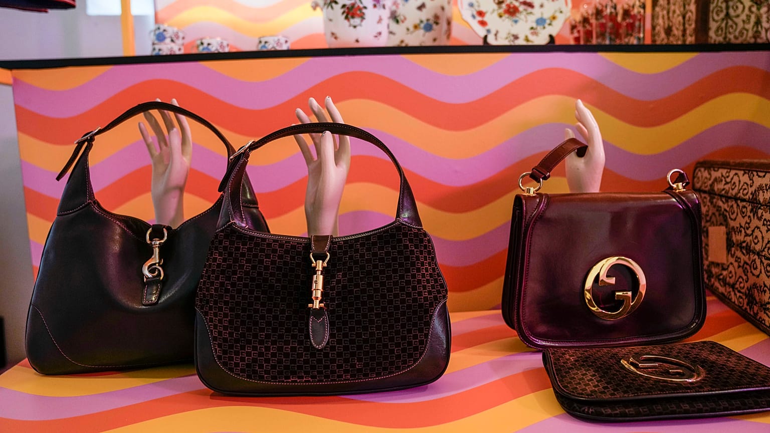 FILE - Vintage Gucci bags are displayed inside the new on-line concept store, called Gucci Vault, in Milan, Italy, Saturday, Sept. 25, 2021.
