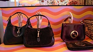 FILE - Vintage Gucci bags are displayed inside the new on-line concept store, called Gucci Vault, in Milan, Italy, Saturday, Sept. 25, 2021.