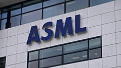 The logo of ASML, a leading maker of semiconductor production equipment, hangs on the head office in Veldhoven, Netherlands, Monday, Jan. 30, 2023. 