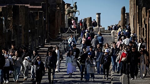 People visit the Pompeii Archaeological Park, near Naples in southern Italy, 15 November, 2024