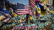 US and Ukrainian national flags wave to commemorate American volunteers, in Kyiv, Ukraine, Friday, Sept. 27 2024.