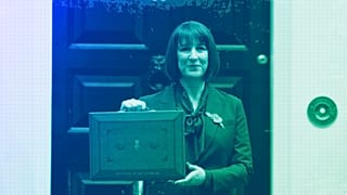 Britain's Chancellor of the Exchequer Rachel Reeves holds up the traditional red ministerial box containing her budget speech in London, October 2024
