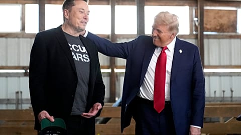 FILE - Tesla and SpaceX CEO Elon Musk, left, and Donald Trump, right, in October.