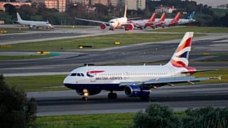 A British Airways passenger jet lands at Lisbon airport, Jan. 25, 2023.