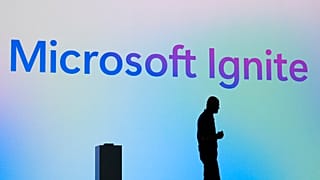 Microsoft CEO Satya Nadella stands in silhouette during the Microsoft Ignite conference Tuesday, Nov. 19, 2024, in Chicago. 