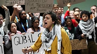 Activists participate in a demonstration for climate finance at the COP29 UN Climate Summit, Saturday, Nov. 23, 2024, in Baku, Azerbaijan.