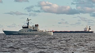 The Chinese cargo ship Yi Peng 3 is anchored and being monitored by a Danish naval patrol vessels in the sea of Kattegat Wednesday, Nov. 20, 2024.