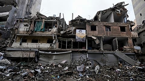 A picture of slain Hezbollah leader Hassan Nasrallah is attached on a destroyed building in Dahiyeh, Beirut, Lebanon, Wednesday, Nov. 27, 2024.