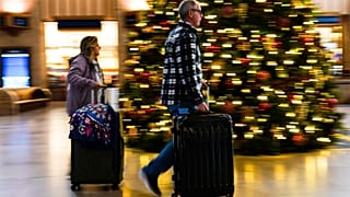 Travellers move through 30th Street Station in Philadelphia, Wednesday, Dec. 21, 2022.