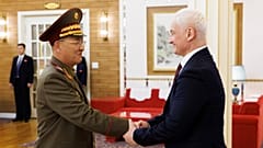 North Korean Defense Minister No Kwang Chol, left, and Russian Defense Minister Andrei Belousov, right, shake hands during their meeting in Pyongyang, North Korea, Friday.
