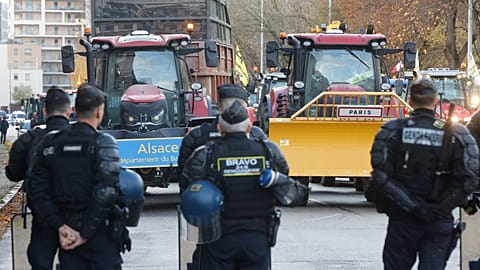 Police officers block farmers as they protest against the Mercosur trade deal treaty, Tuesday, Nov. 26, 2024 in Strasbourg, eastern France