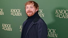 Rupert Grint, İngiltere'nin başkenti Londra'da 'Knock at the Cabin' filminin özel gösteriminde fotoğrafçılara poz veriyor, 25 Ocak 2023.
