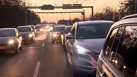 A long line of cars queue on their way to the Hungarian-Austrian border crossing at Sopron. 