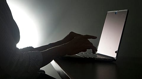 FILE - In this Dec. 12, 2016, file photo illustration, a person types on a laptop in Florida. Riviera Beach, Fla.