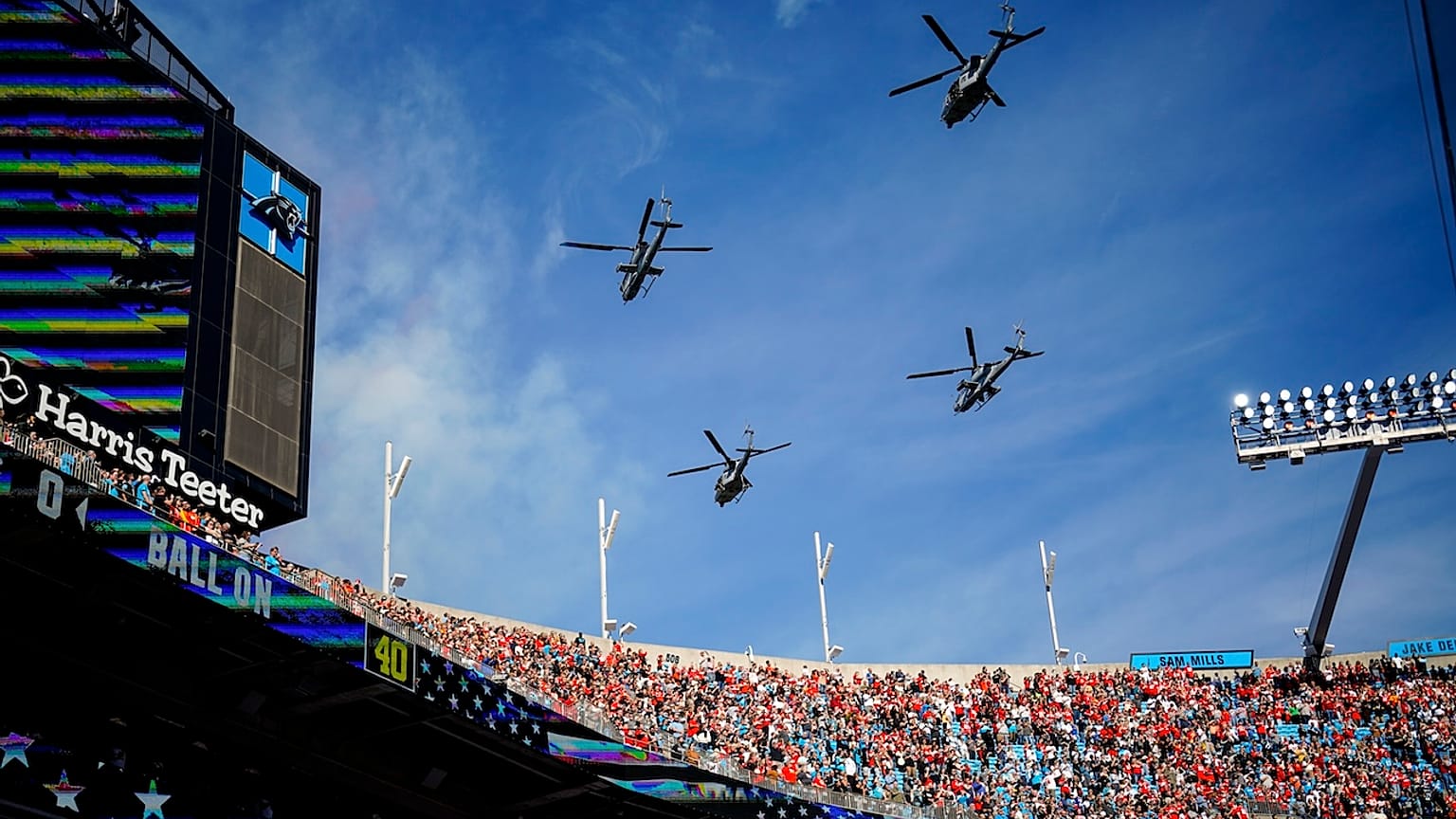 US Marine Light Attack Helicopter Squadron 269 flies over Bank of America Stadium before an NFL football game 