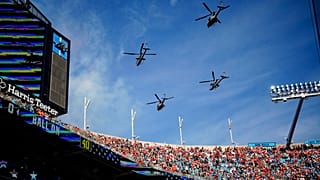 US Marine Light Attack Helicopter Squadron 269 flies over Bank of America Stadium before an NFL football game