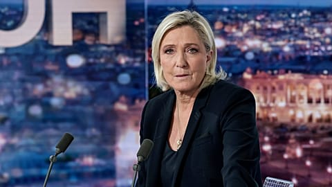 French far-right leader Marine Le Pen poses prior to an interview on French TV channel TF1, in Boulogne-Billancourt, outside Paris, Wednesday, Dec. 4, 2024 