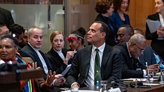 Vanuatu's special climate envoy Ralph Regenvanu prepares to speak as the International Court of Justice in The Hague, Netherlands.