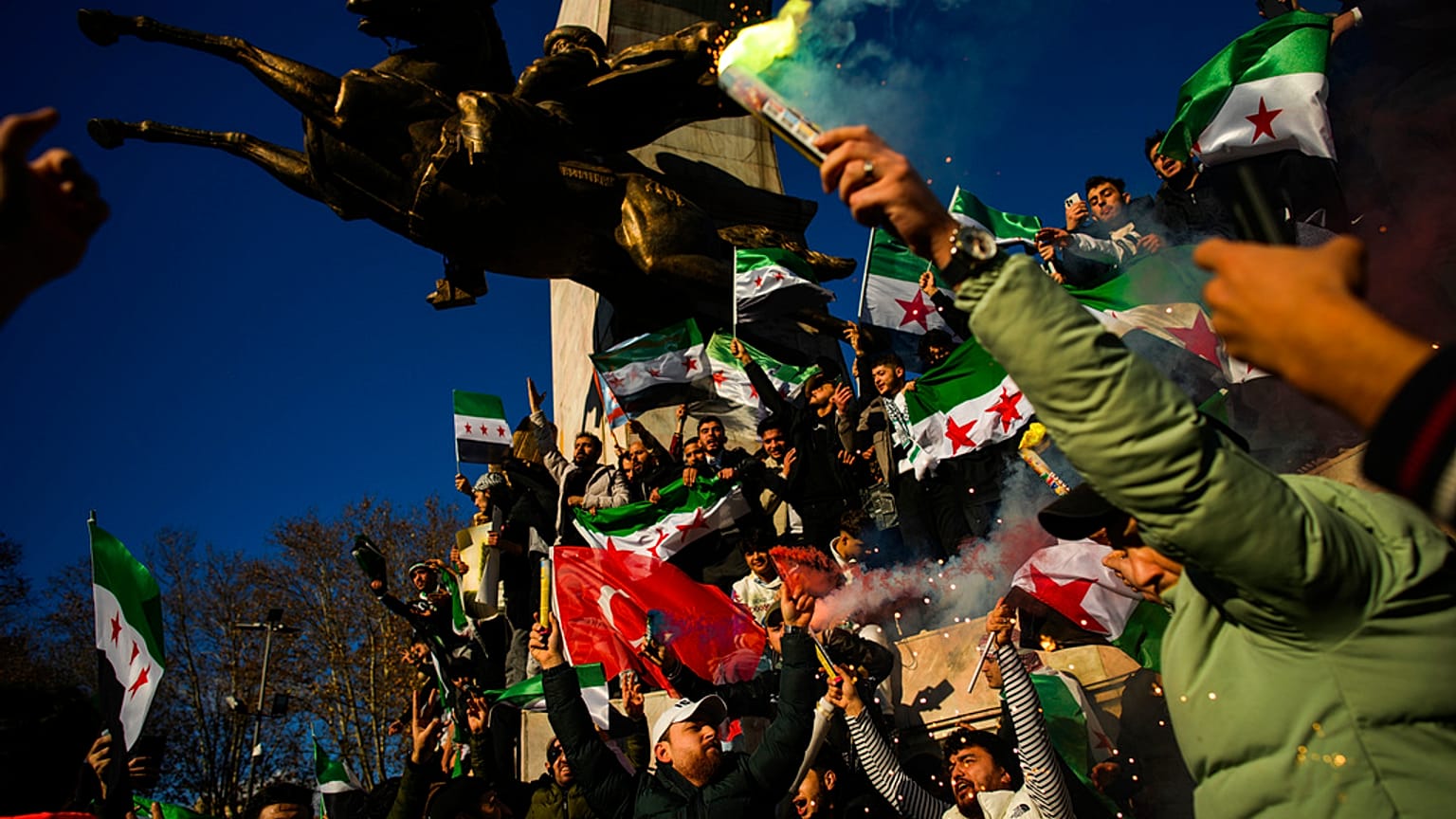 People gather to celebrate the Syrian government fall in Istanbul, Turkey, Sunday, Dec. 8, 2024.