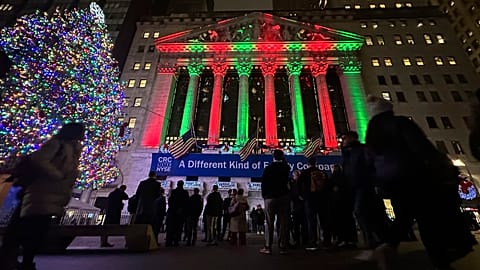 People gather in front of the New York Stock Exchange in New York's Financial District on Tuesday, Dec. 10, 2024.