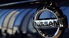 The emblem of Nissan Motor Co. is seen on a car at its global headquarters in Yokohama, near Tokyo