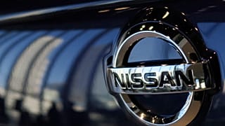 The emblem of Nissan Motor Co. is seen on a car at its global headquarters in Yokohama, near Tokyo