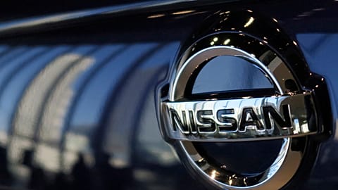 The emblem of Nissan Motor Co. is seen on a car at its global headquarters in Yokohama, near Tokyo