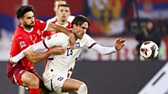 Switzerland's Eray Comert, left, and Serbia's Dusan Vlahovic in action during the UEFA Nations League soccer match between Switzerland and Serbia in Zurich.